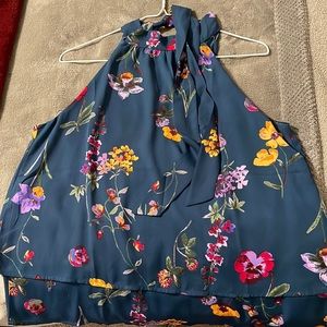 Halter, floral blouse with long ribbon neck ties.
